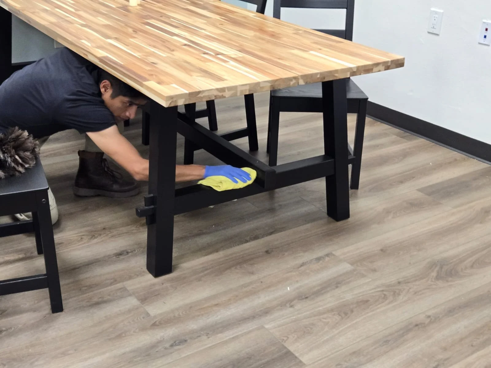 Technician doing detail floor scrubbing after construction in San Diego